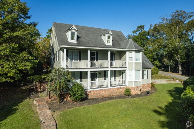 Two-story homes with large balconies are found throughout Green Acres.