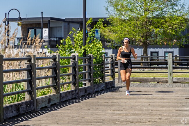 Residents from Carolina Heights enjoy exercising along the riverfront boardwalk.