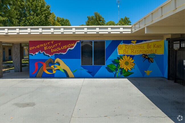 Hudson Elementary School has a mural with positive quotes for a healthy learning space.