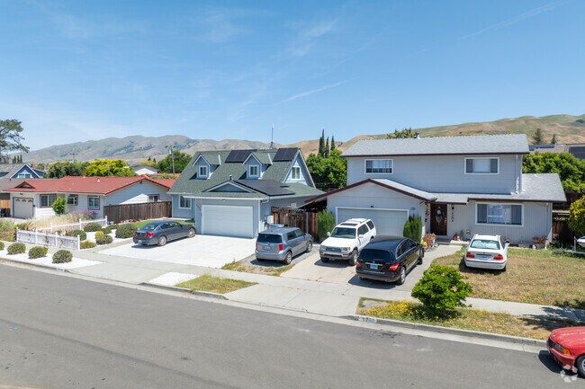 A mix of ranch, Cape Cod, and two-story homes line this scenic, foothill-facing street in Morrill.
