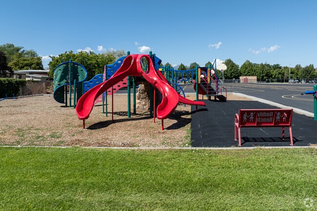 Heartland Elementary School’s colorful playground is built on wood chips and astro turf.