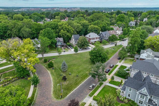 Triangle Park is in the heard of Highland Park offers a recreational area with benches.