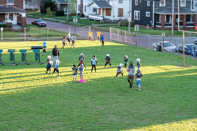 The kids take the field for football practice in the McKinley Fork Northwest neighborhood.