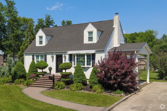 Croydon streets are lined with cape cod homes with pristine landscaping.