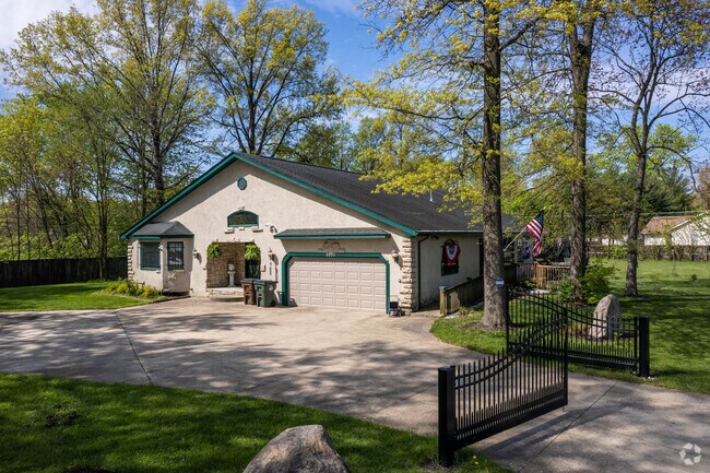 Well kept lawns and lush trees, accent most homes in the neighborhood.