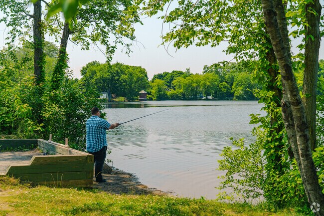Residents of Walnut Square enjoy fishing in the shade of Woidyla Landing.