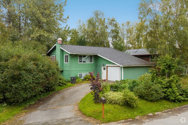Some single-family homes in the University Area are tucked amongst foliage away from the street.