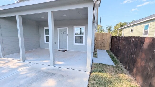 Easy access to the fully fenced backyard.