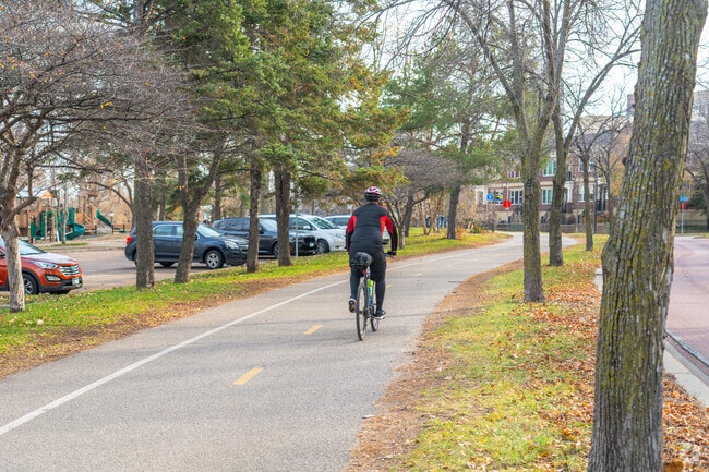 Locals travel along the Mississippi for its bike trails and parks near Nicollet Island.