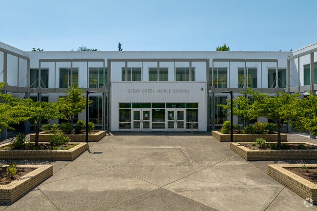A tree lined entrance welcomes students to Clear Creek Middle School on NE 219th Ave in Gresham.