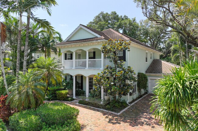 Key West style home with large garden in Colee Hammock community.