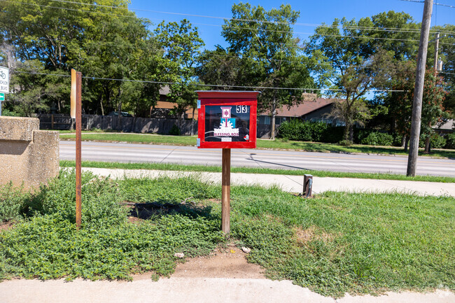 There is a small little library outside of Benton Elementary School.