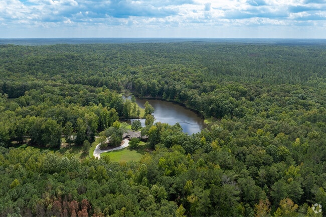 The community provides a serene retreat with green spaces and waterfront views.