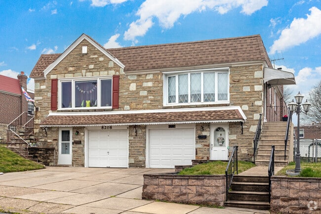 Stone & Brick Twin Ranch with front garage in Pennypack.