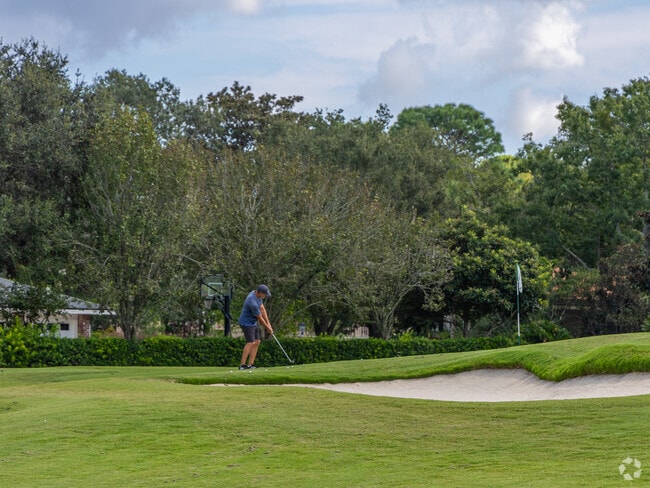A man practices his golf game at the Deerwood Golf Club.