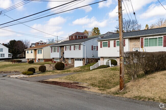 A row of split level homes line the streets in the hills of Versailles.