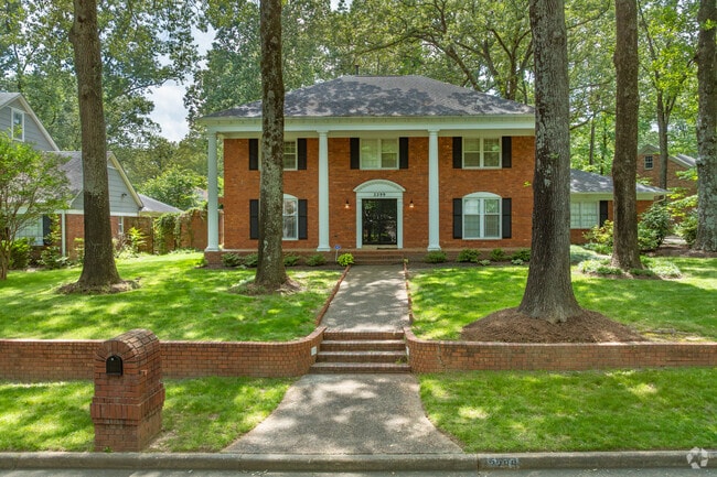 Discover the charm of Kirby Woods, where stately Colonial Revival homes create a picturesque landscape.