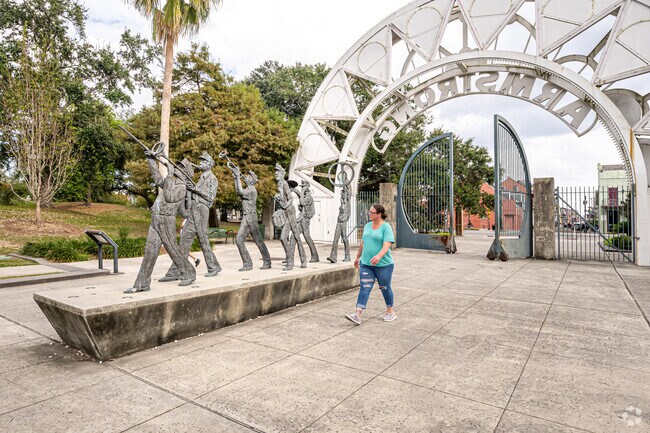 Take in the Second Line sculpture at Louis Armstrong Park.