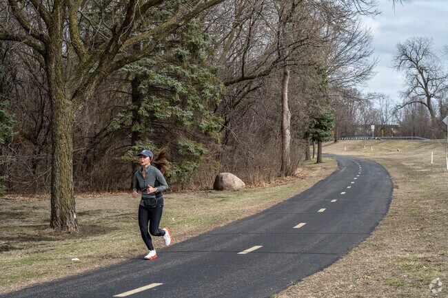 Joggers enjoy the extensive trails around Palmer Lake Park.