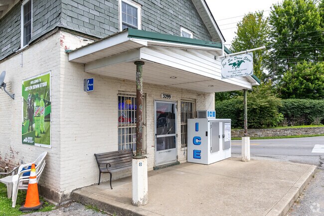 Jot 'Em Down Store in Loradale includes a small lunch area where patrons enjoy freshly made sandwiches, chips, and beer.