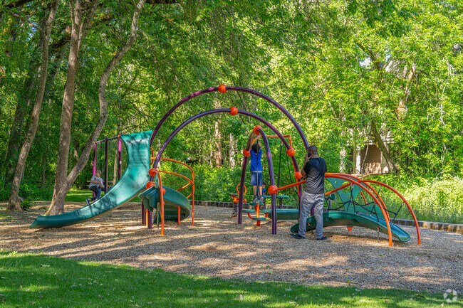 Children can play on the shaded Duck Pond playgrounds in Five Oaks.