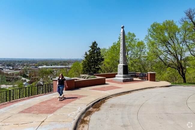 Pedestrians enjoy a stroll near the Lincoln Memorial in The Heights.