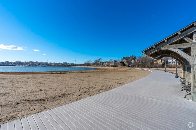 The beach lines of Savin Hill hug the cove with a long boardwalk and and vast sandy beach homes.