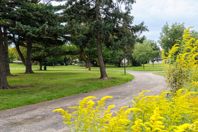 A paved walking path meanders through Simmons Park in Aurora's Pigeon Hill neighborhood.