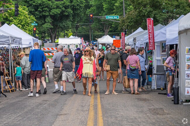 Visitors browse many art vendors at the St. Anthony Park Arts Festival.