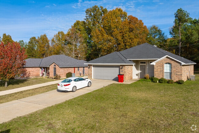 Traditional brick homes sit below mature trees in Town Center.