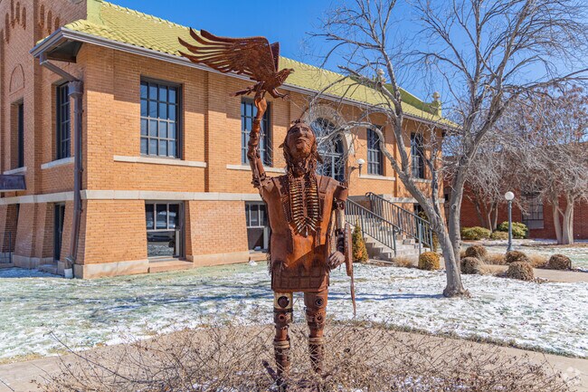 The Carnegie Library sits on the corner of S Adams and W Broadway. Here visitors can see found art statue.