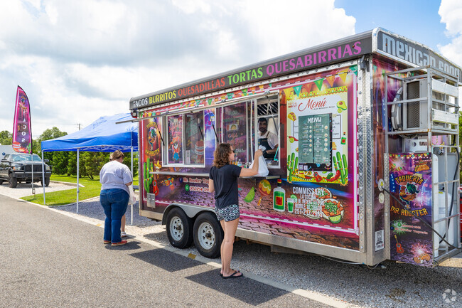 Food Truck Friday can be enjoyed Spring through Summer in downtown Semmes near Camelia.