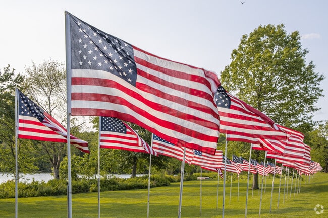 Route 52 in Lake Carmel lines up with American flags each Memorial Day, a quiet show of respect from a town that remembers.