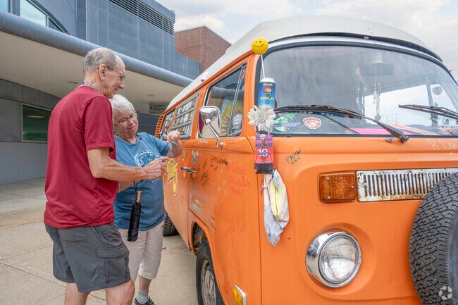 Attendees of Mile of Music can sign the Good Vibes van on College Ave.