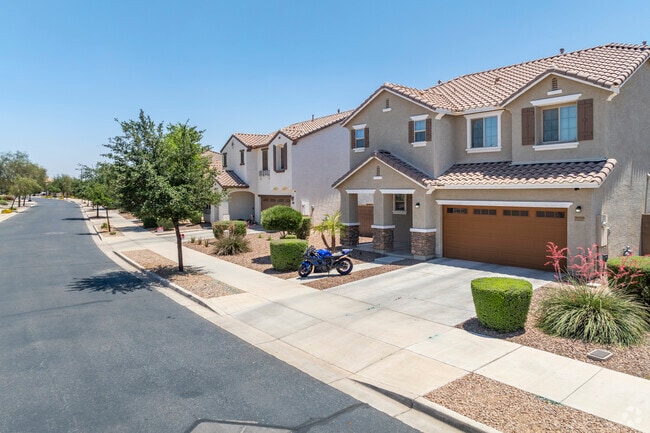The Villages at Queen Creek showcases Southwestern-style homes that blend stucco exteriors with earthy tones, reflecting the natural beauty of the Arizona desert.