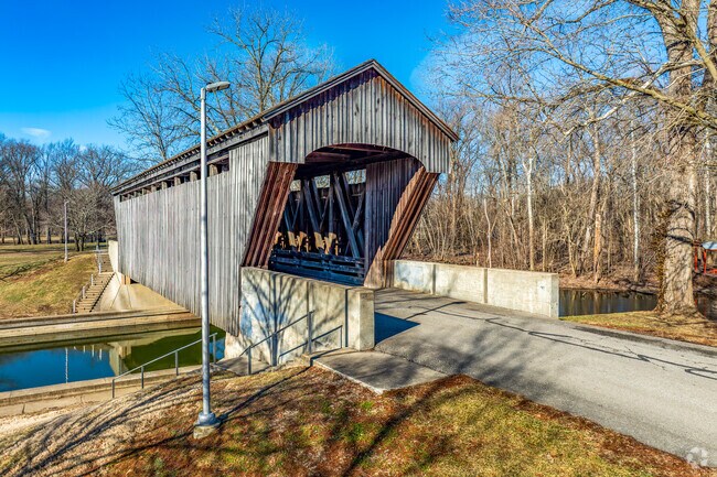 Flatrock River winds past several community green spaces like Mill Race Park.