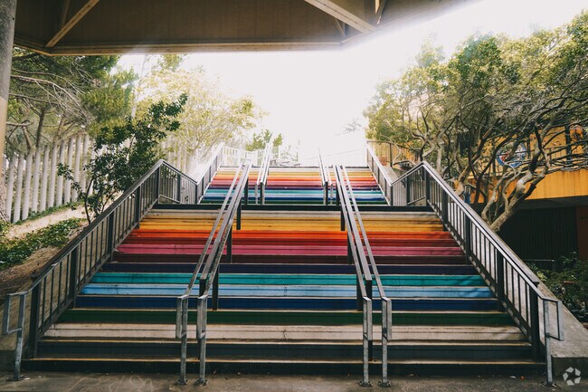 Colorful stairs lead to the entrance of Ruth Asawa School of the Arts.