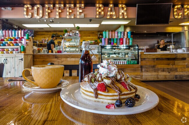 You can stop by Sugar Milk Café to try one of their unique drinks and a good stack of pancakes.