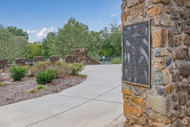 The plaque at Hanes Park entrance commemorates the 47 acres donated by the Hanes family.