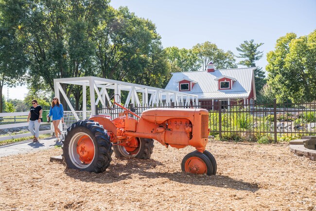 Sibley Park has a decorative tractor next to the koi pond.