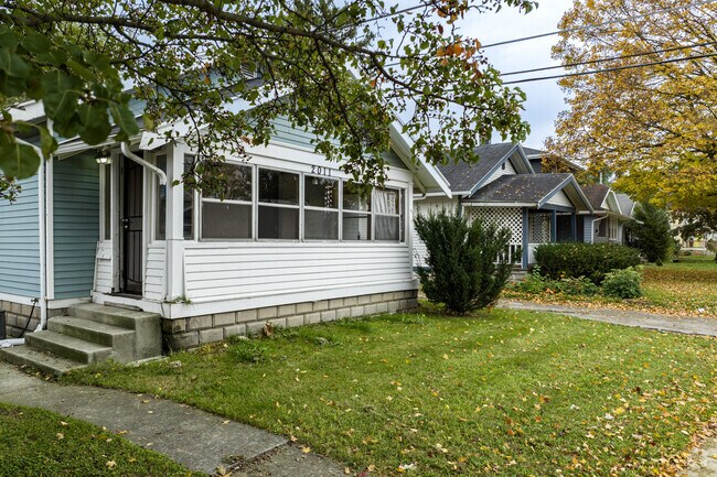 Michigan Avenue homes adorned with inviting screened front porches.