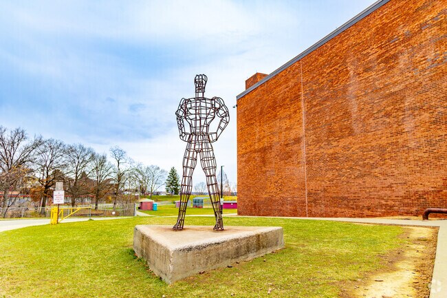 A metal statue stands proud at the entrance to Steel Valley High School serving Munhall students.