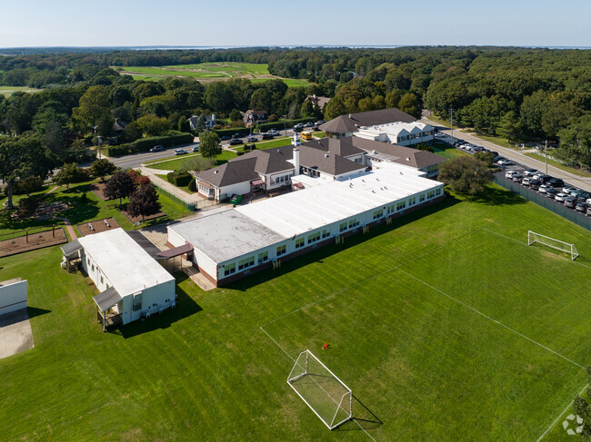 Tuckahoe School has a big green soccer field behind the school.