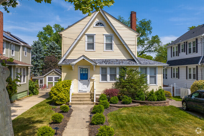 Steeply pitched barn like roofs mark Collingswood Dutch Colonial-Revival homes.