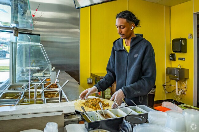 Locals enjoy the ChickenRoti from Trinidad at Sherry's Trini Flavors in Bear Lake.