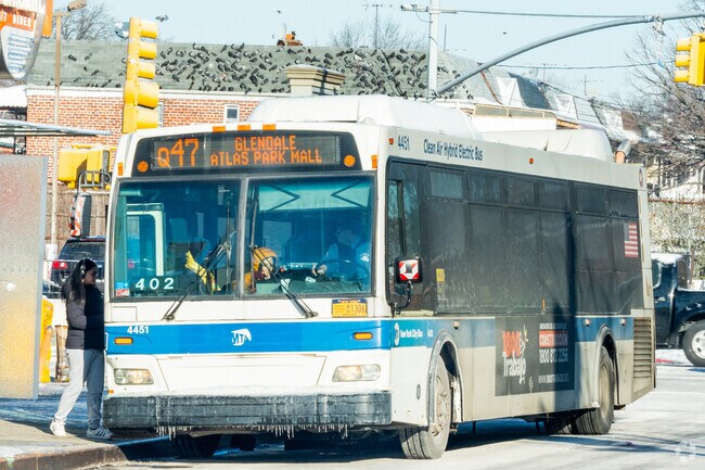 Although no trains run directly through East Elmhurst, there are many buses nearby.