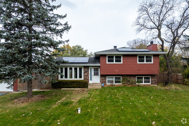 Split level homes in Shore Highlands have colorful exteriors like this red home.