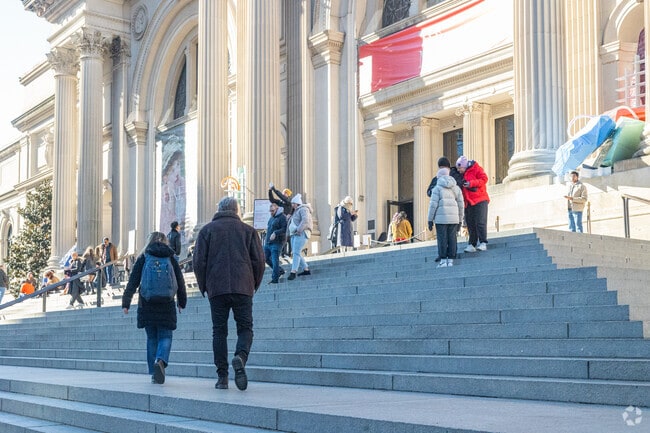 Locals and tourists take in the Metropolitan Museum of Art.