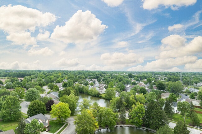 Eagle Creek is surrounded by mature trees and lakes creating a scenic atmosphere.