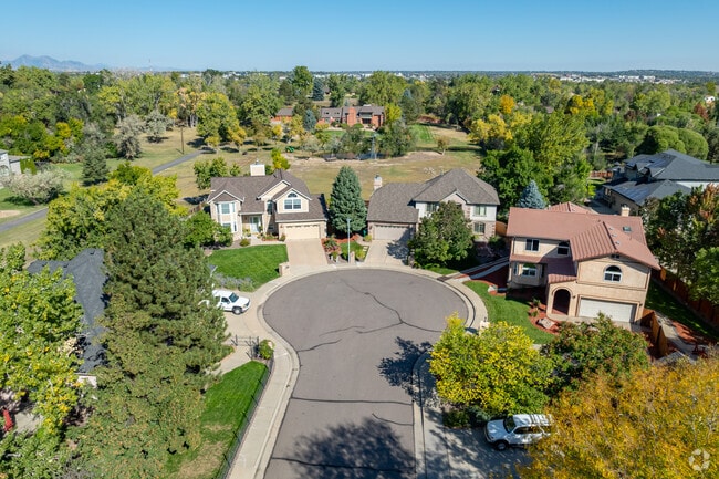 Mature trees fill fenced-in backyards to the brim with natural shade.